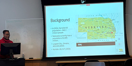 Dr. Afua Ntem-Mensah presents lecture.